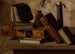 Luonnonkuva still life kirjojen, mustekynän ja kynttilänjalan kanssa - John Frederick Peto — näkymä teoksesta