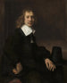 Nuori mies istuu pöydän ääressä, ehkä Govaert Flinck - Rembrandt van Rijn — näkymä teoksesta