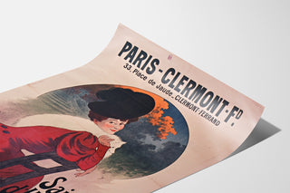 Vintage-juliste Paris-Clermont, talvikausi, esillä kaartuvalla arkilla perspektiivistä kuvattuna.
