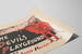 Vintage juliste The Devil’s Playground punaisena ja mustana — näkymä teoksesta