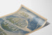 Vintagejuliste The Review of Reviews - heinäkuu, kuvitettu kosmos ja leijonan tähtikuvio